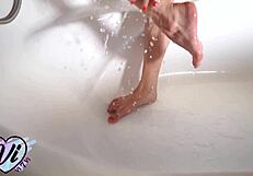 teen masturbates pussy in the bathroom under running water?