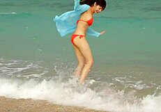 saka okada in silk bikini by the beach
