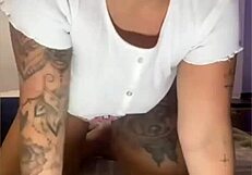 She casually masturbates in tight shorts hugging her ass