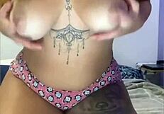 She casually masturbates in tight shorts hugging her ass