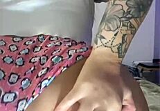 She casually masturbates in tight shorts hugging her ass