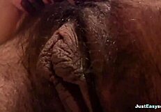 busty babe explores her hairy bush in the bathroom, fingering herself solo until climax