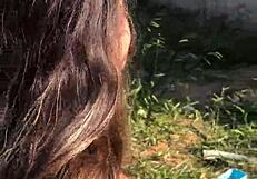 Young girl enters terrain to fuck in bush