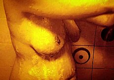 Horny milf enjoys slow motion shower massage