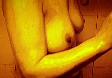 Horny milf enjoys slow motion shower massage