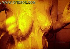 Horny milf enjoys slow motion shower massage