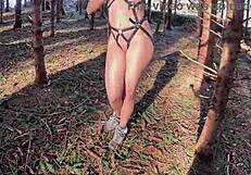 I walk the forest path in sexy harness, hoping for views