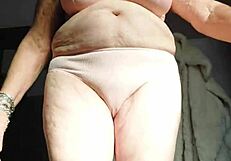 Oma plays and uses cucumber in hairy pussy