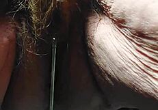 Oma plays and uses cucumber in hairy pussy