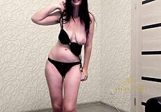 dark-haired woman angela undresses