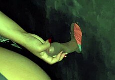 I grind my ass on the black guy's cock and he cums in my hand at the glory hole.