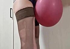 In the dungeon, mistress elza kom worships balloons with her sexy curves and domination skills