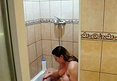 Chubby milf washes and shaves in shower