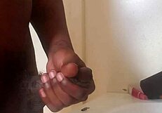 a big black cock gets stroked until it cums