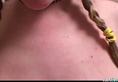 pigtailed brunette plays with big tits