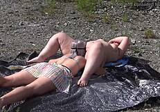 A lesbian washes her friend's pussy outdoors then licks to orgasm