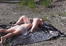 A lesbian washes her friend's pussy outdoors then licks to orgasm