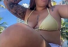 African woman feels excitement flashing on beach