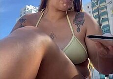 African woman feels excitement flashing on beach