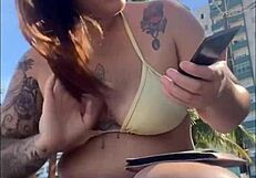 African woman feels excitement flashing on beach