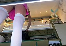 the boss chats with his shop assistant while she talks to the customer