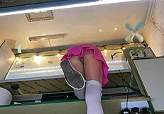 the boss chats with his shop assistant while she talks to the customer