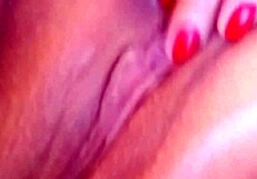 feeling the wetness of her pink pussy while masturbating