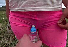 I'm watching my girlfriend get fucked doggystyle with a bottle outdoors