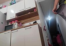 The wife takes a risk, having sex with her husband's friend in a homemade setting, exploring forbidden desires.