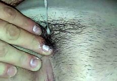 Amateur wife receives a cameltoe massage from her husband.