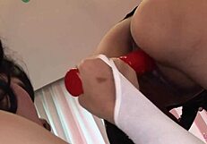 Mintra And Sansanee! Fucking Each Other With Big Red Dildo On Glass Table!