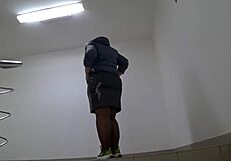 public foot fetish features fat legs in nylon on mall stairs under skirt