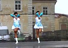 two nice majorettes perform cheerleading routines