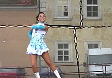 two nice majorettes perform cheerleading routines