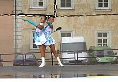 two nice majorettes perform cheerleading routines