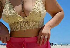 Beach lover flashes pussy to make him hard.