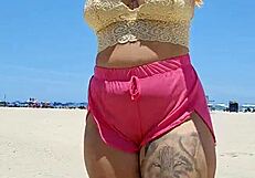 Beach lover flashes pussy to make him hard.