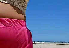 Beach lover flashes pussy to make him hard.