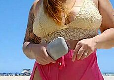 Beach lover flashes pussy to make him hard.