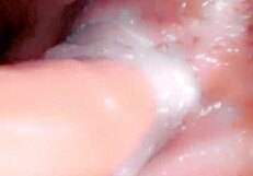 The creamy wetness coats her slutty ass and pussy in this steamy encounter.