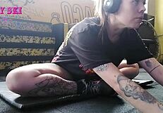 Alternative girl stretching at the gym?