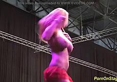 cock sharing on public sex fair stage?