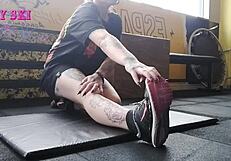 Alternative girl stretching at the gym?