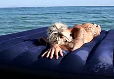 nude blonde beauty exposes big boobs on public beach with dolphin tattoo