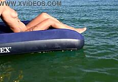 nude blonde beauty exposes big boobs on public beach with dolphin tattoo