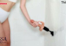 skinny babe spreads wet pussy close-up with toy on bed