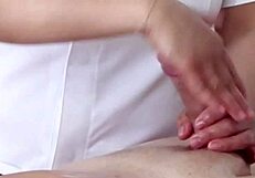 Close-up oiled massage handjob ends with huge cumshot pov