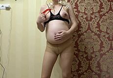 pregnant milf slips into sexy outfit and toys her hairy pussy solo