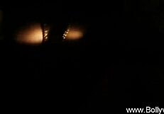 the erotic indian brunette slowly strips teasing her nude curves in a seductive dance