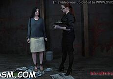 She spreads the bound slave's vagina wide for toys